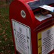 A voter drops off an absentee ballot for the November 3, 2020 elections into a collecting bin outside Fairfax County Government Center on October 19, 2020 in Fairfax, Virginia.